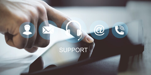 Customer support concept with icons for communication methods over touchscreen device, symbolizing...