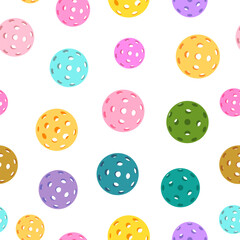 Seamless pattern of colorful pickleballs with perforated surfaces on a white background