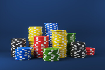 Colorful stacks of casino chips arranged on a clean dark blue background for gambling, jackpot, or...