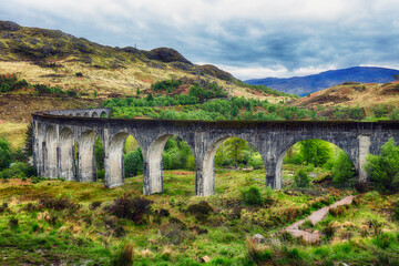 Naklejka premium Glenfinnan Viaduct at dramatic sunset, Scotland landscape, UK