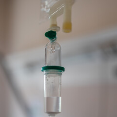 Close-Up View of Intravenous Drip Bag inside Hospital Room