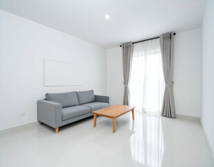 A bright minimalist living room with a grey sofa, wooden coffee table, and soft curtains, creating a clean and modern atmosphere.