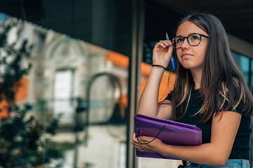 Teenage girl finishes up homework before school