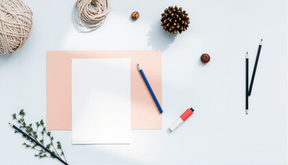 Minimalist Desk Workspace with Notepad, Pen, and Decorative Elements in Neutral Tones