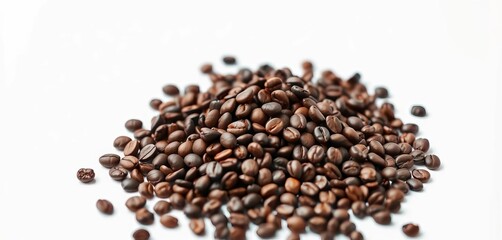 A mound of dark roasted coffee beans spills onto a pristine white surface,  mocha,  coffee shop