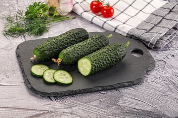 Raw green cucumbers with slices