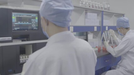 Researchers team lab coats safety gloves, surrounded by various scientific instruments, conducting biological experiment with automated machinery innovative vaccine projects, collaboration innovation - Powered by Adobe