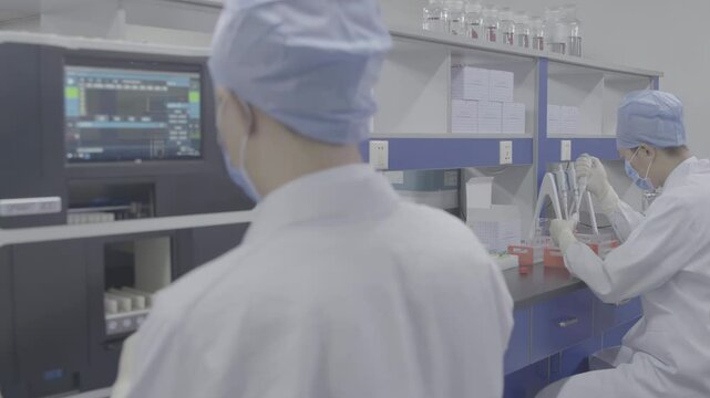 Researchers team lab coats safety gloves, surrounded by various scientific instruments, conducting biological experiment with automated machinery innovative vaccine projects, collaboration innovation - Powered by Adobe