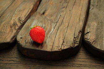 Beautiful, fresh, ripe strawberries on a wooden table. Concept, strawberries as a symbol of love...
