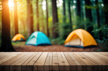 Wood tabletop backdrop. Blurry camping scene. Tent, forest, outdoor adventure.