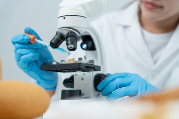 Scientist analyze biochemical samples in advanced scientific laboratory. Medical professional use...