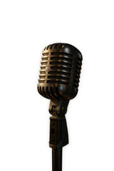 Fototapeta premium A classic retro vintage microphone stands illuminated on a stage, evoking the golden age of broadcasting, music, and live performance with its timeless design.