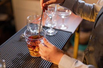  Professional female bartender preparing alcoholic drinks in a bar