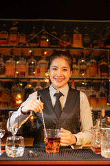  Professional female bartender preparing alcoholic drinks in a bar