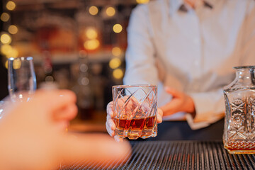  Professional female bartender preparing alcoholic drinks in a bar