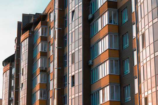 high rise living multi apartment building walls and windows exterior facade urban close up background