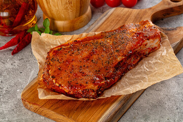 Raw marinated pork loin steak