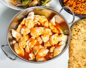 top down view of a chinese chicken with sweet and sour sauce meal