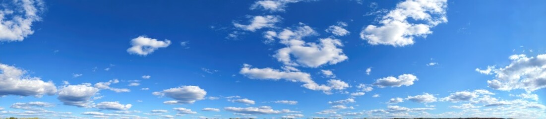 Fototapeta premium Wide shot of a partly cloudy blue sky (1)