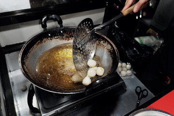 Round cimol, a traditional Sundanese snack, being cooked and  will be seasoned for a modern twist!...
