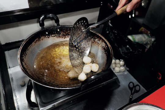 Round cimol, a traditional Sundanese snack, being cooked and  will be seasoned for a modern twist! A delicious street food favorite.