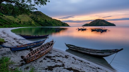Obraz premium Sunset fishing boats on serene beach tropical island nature landscape calm waters scenic viewpoint tranquility