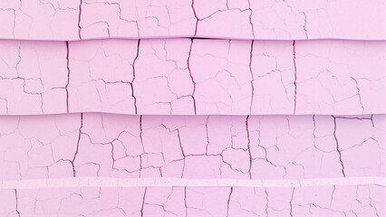 Close-up of cracked pastel pink painted wall with textured surface and peeling paint