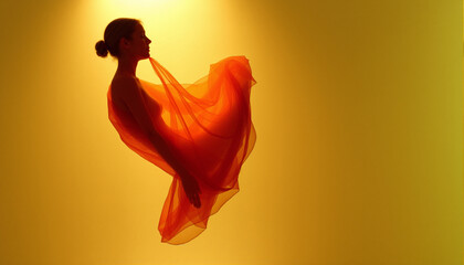 Silhouette of a woman in an elegant orange dress suspended in mid-air against a warm yellow background, creating a striking visual with flowing fabric and dynamic movement, emphasizing grace and artis