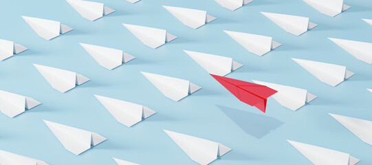Red paper plane flying above a crowd of white planes on blue background. Concept of leadership, breakthrough thinking, standing out, success, and business innovation.