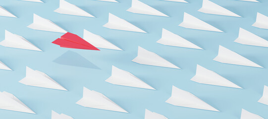 Red paper plane flying above a crowd of white planes on blue background. Concept of leadership, breakthrough thinking, standing out, success, and business innovation.
