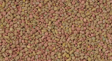 A dense, textured image showcasing a multitude of pastel-colored pills and tablets, varying in shape and size.  The overall tone is soft and slightly muted.