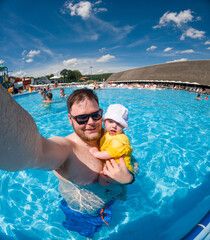 Father and Baby Enjoying Pool Time