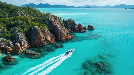 Fototapeta premium Scenic turquoise waters surround rocky coastline.