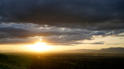 Golden sunset sky clouds in the evening sunrise.