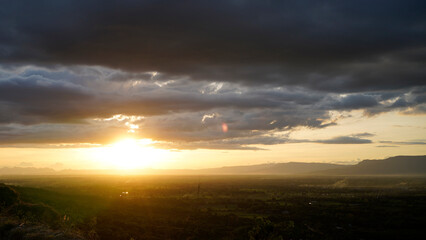 Golden sunset sky clouds in the evening sunrise.