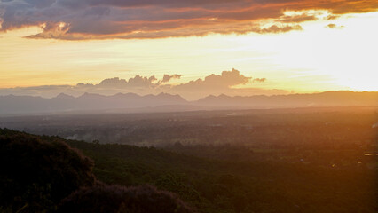 Golden sunset sky clouds in the evening sunrise.