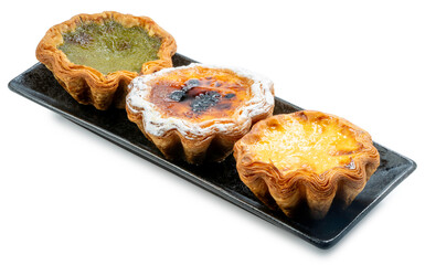 Freshly baked Egg tart in black plate on white background, Egg tart in black plate on white.