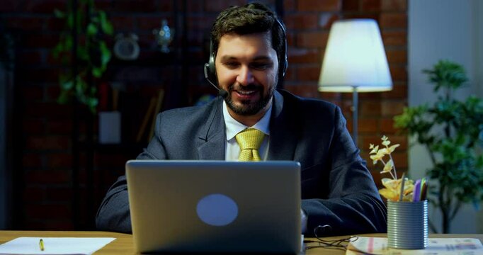 Indian businessman in call centre, Indian Asian corporate executive wearing headset and busy in communication, symbol of customer service, tech support, remote assistance, global connectivity