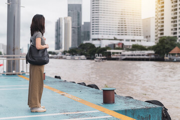 Solo southeast asian woman teenager blogger and world travel explorer get local cultural...