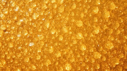 Unique texture of golden honeycomb pattern reflecting light, perfect for nature, food, background, health, sweet themes, close-up, warm tones, natural, organic, vibrant ambiance, detailed surface ima