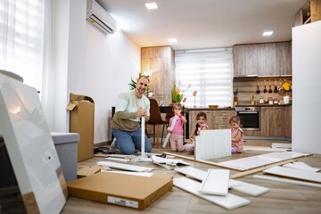 Family bonding through home assembly activity in a cozy kitchen