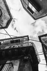 Upward Black and White View of Historic Sicilian Buildings and Wires