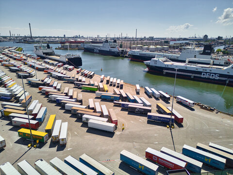 Ferry terminal with DFDS ships and parking full of trailers ready to be loaded for transport to the UK in Port of Rotterdam, Vlaardingen, Netherlands