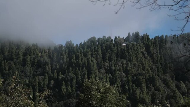A timelapse showing the movement of clouds during the monsoons over a hill at Nainital, uttarakhand