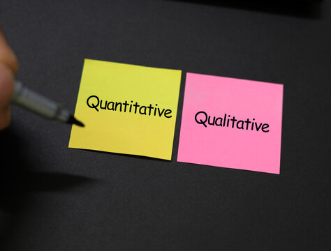 paper with the words quantitative and qualitative. two fundamental approaches to research and data analysis