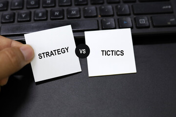 Two opposite words strategy and tactics. Strategy is the overarching plan or overarching goal,...