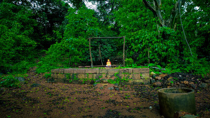 small statue of the sant at kankeshwar temple in maharashtra in india.