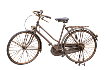 Vintage rusty bicycle with metal frame and leather seat isolated on black background image