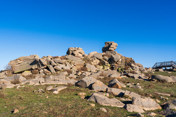 The strange rocks on the mountain are under the blue sky