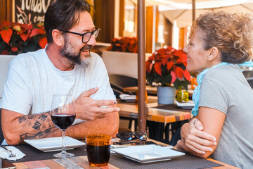 Happy couple enjoying meal at restaurant – romantic date, vacation mood, weekend vibes,...